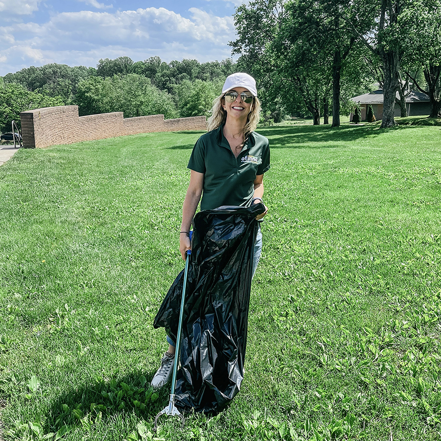 Ofinno team member volunteering at a community cleanup